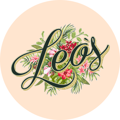 Floral and botanical-themed circle with the word "leos" written in cursive, surrounded by varied green leaves and red flowers on a light pink background.
